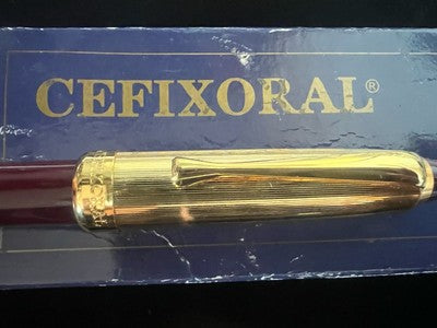 🔴 Penna roller CEFIXORAL bordò cappuccio dorato scrive con astuccio