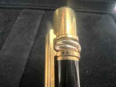 🔴 CARTIER penna sfera Must de Cartier Trinity Twist lacca nera finiture dorate
