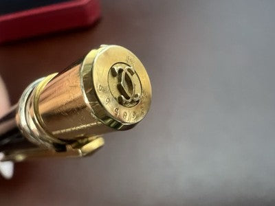 🔴 CARTIER penna sfera Must de Cartier Trinity Twist lacca nera finiture dorate