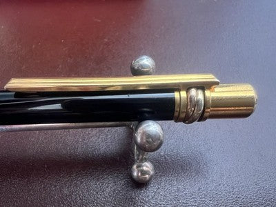 🔴 CARTIER penna sfera Must de Cartier Trinity Twist lacca nera finiture dorate