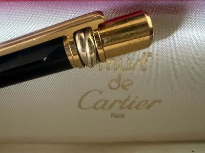 🔴 CARTIER penna sfera Must de Cartier Trinity Twist lacca nera finiture dorate