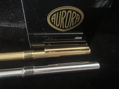 🔴 AURORA penna sfera Marco Polo dorata rigata e e cromata liscia scrivono
