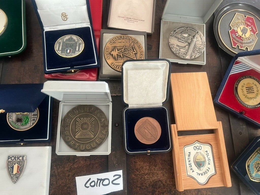 Medals Police International And Cardboard Marble IN Cases Stock 2